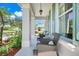 Inviting front porch with comfortable seating, perfect for enjoying the outdoors at 13822 Darchance Rd, Windermere, FL 34786