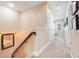 Hallway features carpeting, neutral walls, and sconce lighting at 13822 Darchance Rd, Windermere, FL 34786