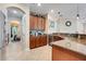 Kitchen view showcasing cabinetry, granite countertops, stainless steel appliances, and tile flooring at 13822 Darchance Rd, Windermere, FL 34786