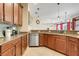 Open kitchen design with granite countertops, stainless steel appliances, and tile flooring at 13822 Darchance Rd, Windermere, FL 34786