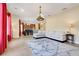 Open living area with a plush sectional sofa, stylish rug, and modern chandelier at 13822 Darchance Rd, Windermere, FL 34786