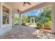 Covered patio overlooking a landscaped yard, perfect for relaxation and outdoor enjoyment at 13822 Darchance Rd, Windermere, FL 34786