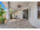 Covered patio with brick flooring and a ceiling fan for outdoor comfort and entertaining at 13822 Darchance Rd, Windermere, FL 34786