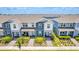 Aerial view of the townhouses showing rooflines and landscaping at 14250 Sapelo Beach Dr, Orlando, FL 32827