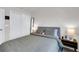 Bedroom featuring a comfortable bed, side tables with lamps, and mirrored closet doors at 14250 Sapelo Beach Dr, Orlando, FL 32827
