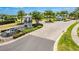 Elegant community entrance with lush landscaping, decorative fountain and a guard house for secure access at 14250 Sapelo Beach Dr, Orlando, FL 32827