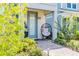 Cozy front porch with a modern chair, plant, and walkway at 14250 Sapelo Beach Dr, Orlando, FL 32827