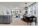 Open-concept living room and dining area with modern decor and natural light at 14250 Sapelo Beach Dr, Orlando, FL 32827