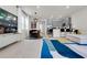 Open-concept living area connecting kitchen and dining, with modern furnishings and ample natural light at 14250 Sapelo Beach Dr, Orlando, FL 32827