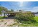 Backyard patio with a wooden pergola covered in flowers, and a spacious area for outdoor dining and entertaining at 1460 Spring Ridge Cir, Winter Garden, FL 34787