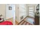 Bright entryway with tiled floors and view of a bathroom with a doorway at 1460 Spring Ridge Cir, Winter Garden, FL 34787