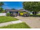 This single-story home features a well-maintained lawn, driveway, and ample parking space at 1460 Spring Ridge Cir, Winter Garden, FL 34787