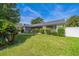 Well-maintained single-story home with lush landscaping and a manicured front lawn at 1460 Spring Ridge Cir, Winter Garden, FL 34787