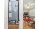 View of an Armstrong HVAC unit in a closet with a peek at the living room with a ceiling fan and TV at 1460 Spring Ridge Cir, Winter Garden, FL 34787