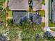 Aerial view showcasing the property, roof, backyard, and surrounding neighborhood at 14835 Old Thicket Trce, Winter Garden, FL 34787
