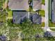 Aerial view showcasing the property, roof, backyard, and surrounding neighborhood at 14835 Old Thicket Trce, Winter Garden, FL 34787