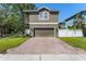 Exterior view of front of house with garage and driveway at 14835 Old Thicket Trce, Winter Garden, FL 34787
