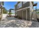 Exterior view of the rear of the home featuring an outdoor staircase at 14835 Old Thicket Trce, Winter Garden, FL 34787