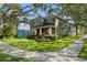 Well-maintained two story house with lush green lawn and colorful landscaping at 14835 Old Thicket Trce, Winter Garden, FL 34787