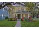 Charming two-story home with a well-manicured lawn and inviting front porch at 14835 Old Thicket Trce, Winter Garden, FL 34787