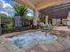 Outdoor hot tub with spa rules posted and lounge chairs for relaxation at 14835 Old Thicket Trce, Winter Garden, FL 34787