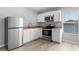 Modern kitchen featuring stainless steel appliances and granite countertops at 14835 Old Thicket Trce, Winter Garden, FL 34787