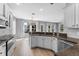 Spacious kitchen with modern appliances, granite counters, and an open layout at 14835 Old Thicket Trce, Winter Garden, FL 34787