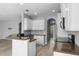 Modern kitchen boasts granite countertops, white cabinets, and a breakfast bar area at 14835 Old Thicket Trce, Winter Garden, FL 34787