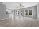 Spacious open-concept living area with large windows, hardwood floors, and modern finishes at 14835 Old Thicket Trce, Winter Garden, FL 34787