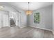 Bright living room featuring hardwood floors, neutral walls, and natural light at 14835 Old Thicket Trce, Winter Garden, FL 34787