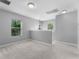 Carpeted loft area featuring natural light and versatile space at 14835 Old Thicket Trce, Winter Garden, FL 34787
