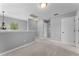 Upstairs loft area offers flexible space with neutral carpet and natural light at 14835 Old Thicket Trce, Winter Garden, FL 34787