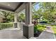Inviting front porch view with brick pathway and lush green lawn at 14835 Old Thicket Trce, Winter Garden, FL 34787