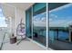 This balcony offers views of the lake and the city with a hanging chair at 150 E Robinson St # 16B-2 1605, Orlando, FL 32801