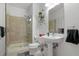 Modern bathroom featuring a walk-in shower, vanity sink, and contemporary fixtures at 150 E Robinson St # 16B-2 1605, Orlando, FL 32801