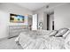 This primary bedroom features a TV, an ensuite bathroom, and an open-concept living area at 150 E Robinson St # 16B-2 1605, Orlando, FL 32801