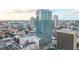 Beautiful high-rise exterior, showcasing its modern design amidst the vibrant cityscape and clear blue skies at 150 E Robinson St # 16B-2 1605, Orlando, FL 32801