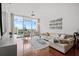 Bright living room featuring a large sectional sofa, modern decor, floor-to-ceiling windows, and gorgeous views at 150 E Robinson St # 16B-2 1605, Orlando, FL 32801