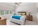 Bright bedroom with a large window, neutral walls, and coastal-themed decor at 15049 Canopy Cover Dr, Winter Garden, FL 34787