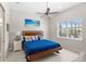 Bright bedroom with a large window, neutral walls, and view of lanai at 15049 Canopy Cover Dr, Winter Garden, FL 34787