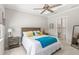 Bright bedroom with ensuite bathroom and coastal-themed decor at 15049 Canopy Cover Dr, Winter Garden, FL 34787