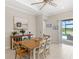 Bright dining room featuring a stylish buffet and sliding doors to the pool area at 15049 Canopy Cover Dr, Winter Garden, FL 34787