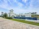 Del Webb Oasis community entrance featuring a modern sign, lush landscaping, and inviting architecture at 15049 Canopy Cover Dr, Winter Garden, FL 34787