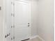 Entryway with white door, neutral wall paint and flooring at 15049 Canopy Cover Dr, Winter Garden, FL 34787