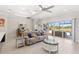Bright living room with tile floors offers access to pool and backyard at 15049 Canopy Cover Dr, Winter Garden, FL 34787