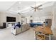 Bright open-concept living space offers access to kitchen, dining area, and backyard at 15049 Canopy Cover Dr, Winter Garden, FL 34787