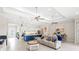 Open concept living area showcases tile floors and tray ceilings at 15049 Canopy Cover Dr, Winter Garden, FL 34787