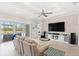 Open living space featuring tile floors and large sliding glass doors at 15049 Canopy Cover Dr, Winter Garden, FL 34787
