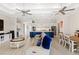 Open-concept living room with a large island, modern appliances, and a dining area at 15049 Canopy Cover Dr, Winter Garden, FL 34787