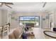 Comfortable living room with plush seating and a large sliding glass door to the pool at 15049 Canopy Cover Dr, Winter Garden, FL 34787